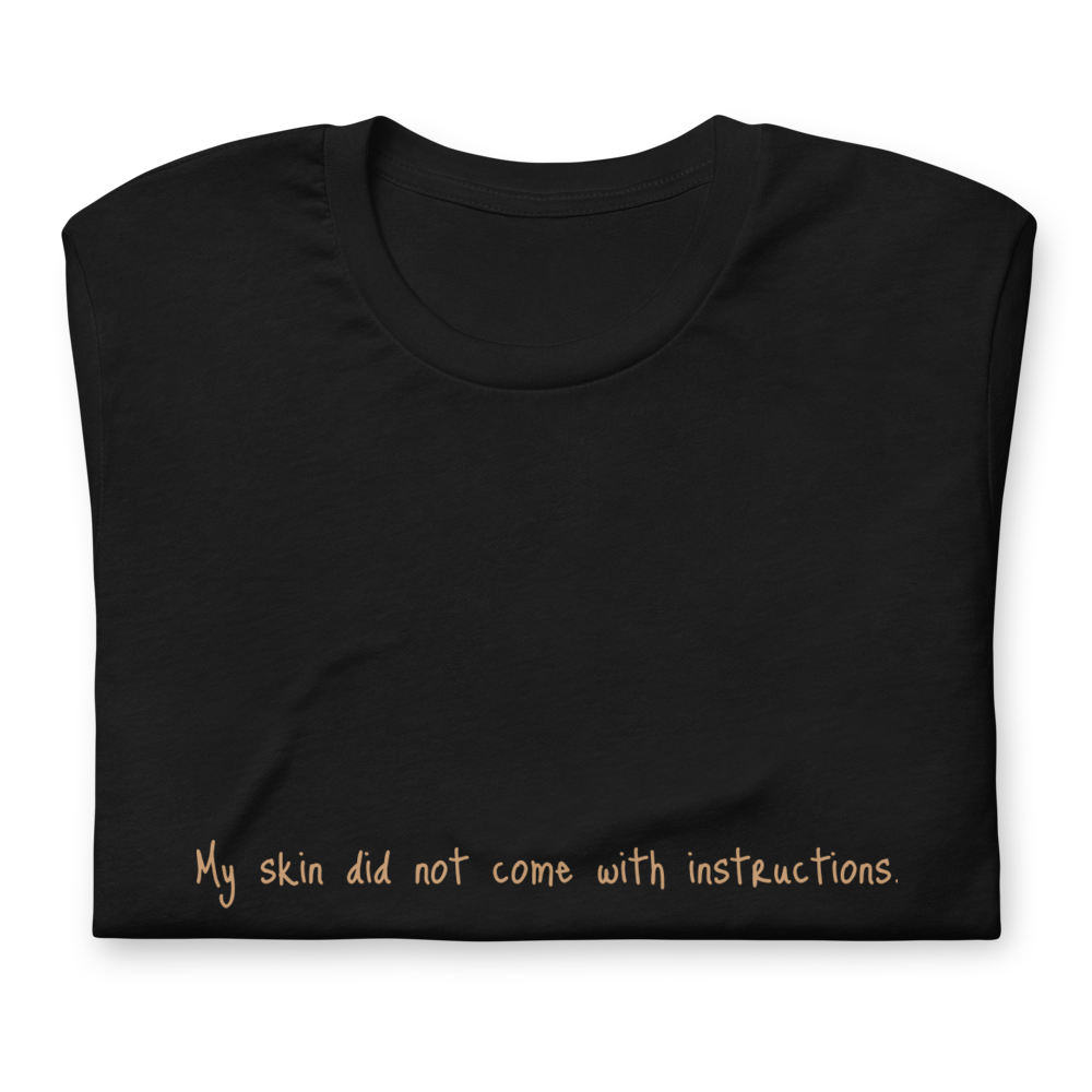Short-Sleeve Unisex "My skin did not come with instructions." T-Shirt (Tan Lettering)