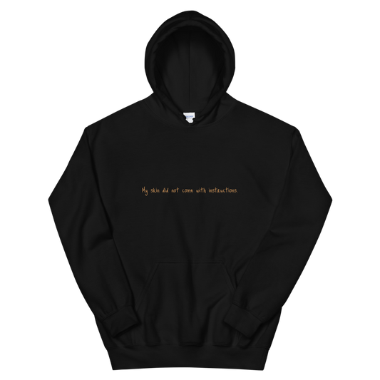 Unisex "My skin did not come with instructions." Hooded Sweatshirt (Tan Lettering)