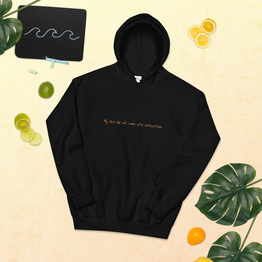 Unisex "My skin did not come with instructions." Hooded Sweatshirt (Tan Lettering)