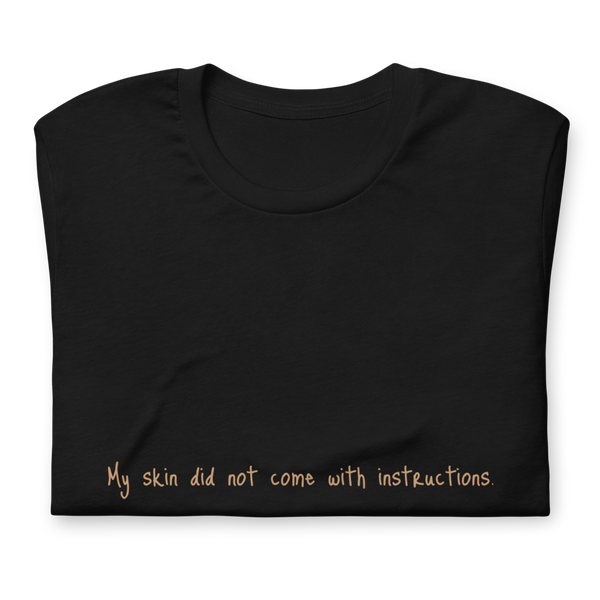 Short-Sleeve Unisex "My skin did not come with instructions." T-Shirt (Tan Lettering)