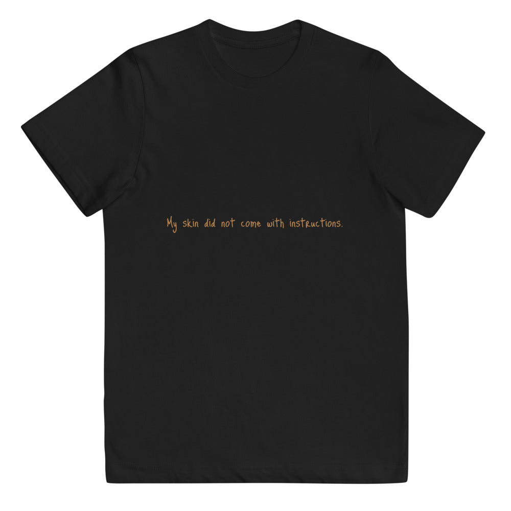 Unisex Youth Short Sleeve "My skin did not come with instructions." Tee (Tan Lettering)